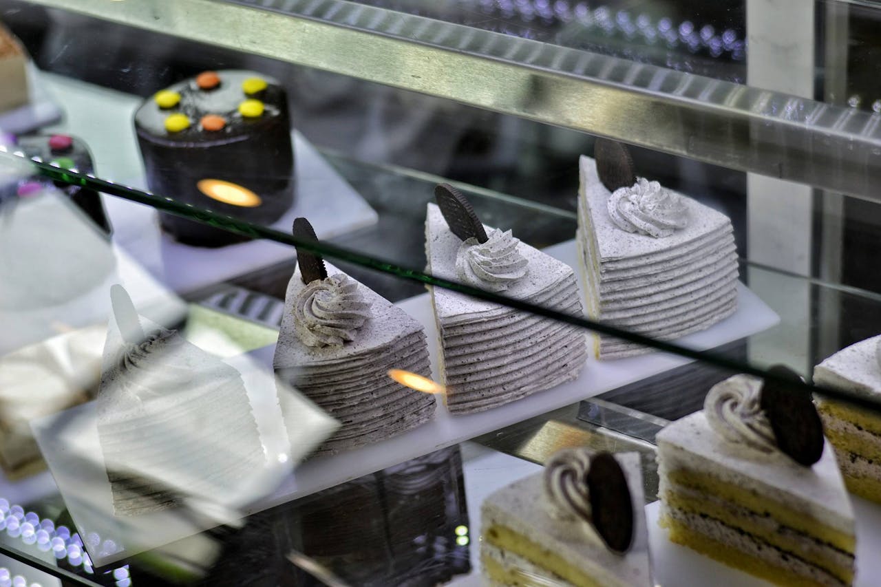 A selection of delicious gourmet cakes displayed in a bakery in Ahmedabad, India.